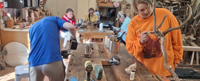 students at Meristem working in the wood shop as part of their evidence-based educational practices for autism